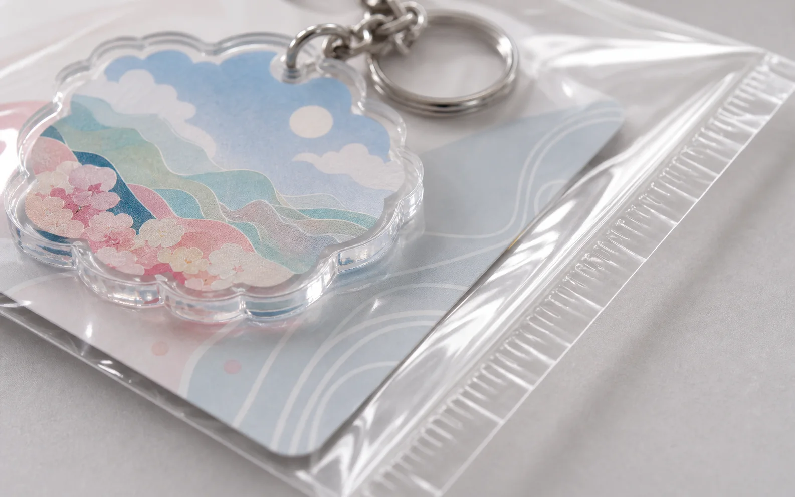 Finished acrylic charm sealed in an OPP bag beside a measuring ruler