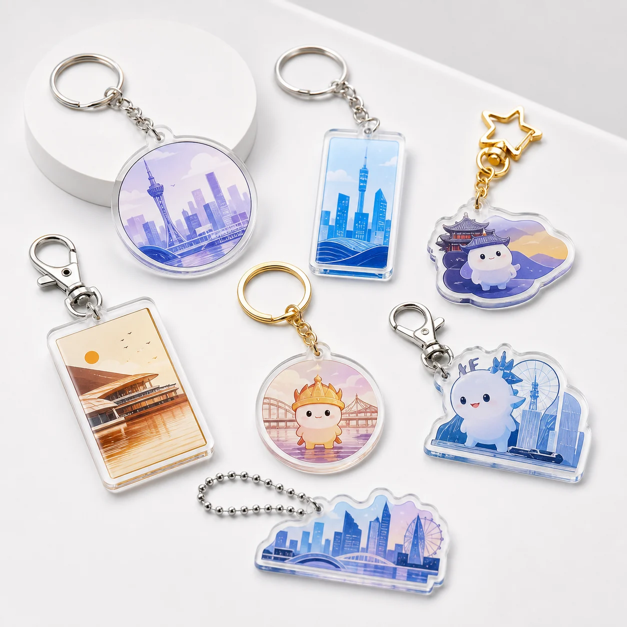 Acrylic keychains with metal clasps in assorted die-cut shapes and city artwork